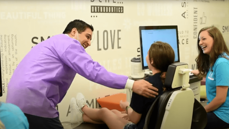 Doctor, assistant, and patient sharing a laugh at Behl Orthodontics