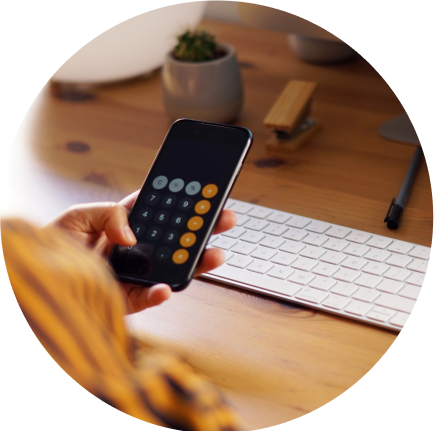 Person using the calculator app on their iPhone