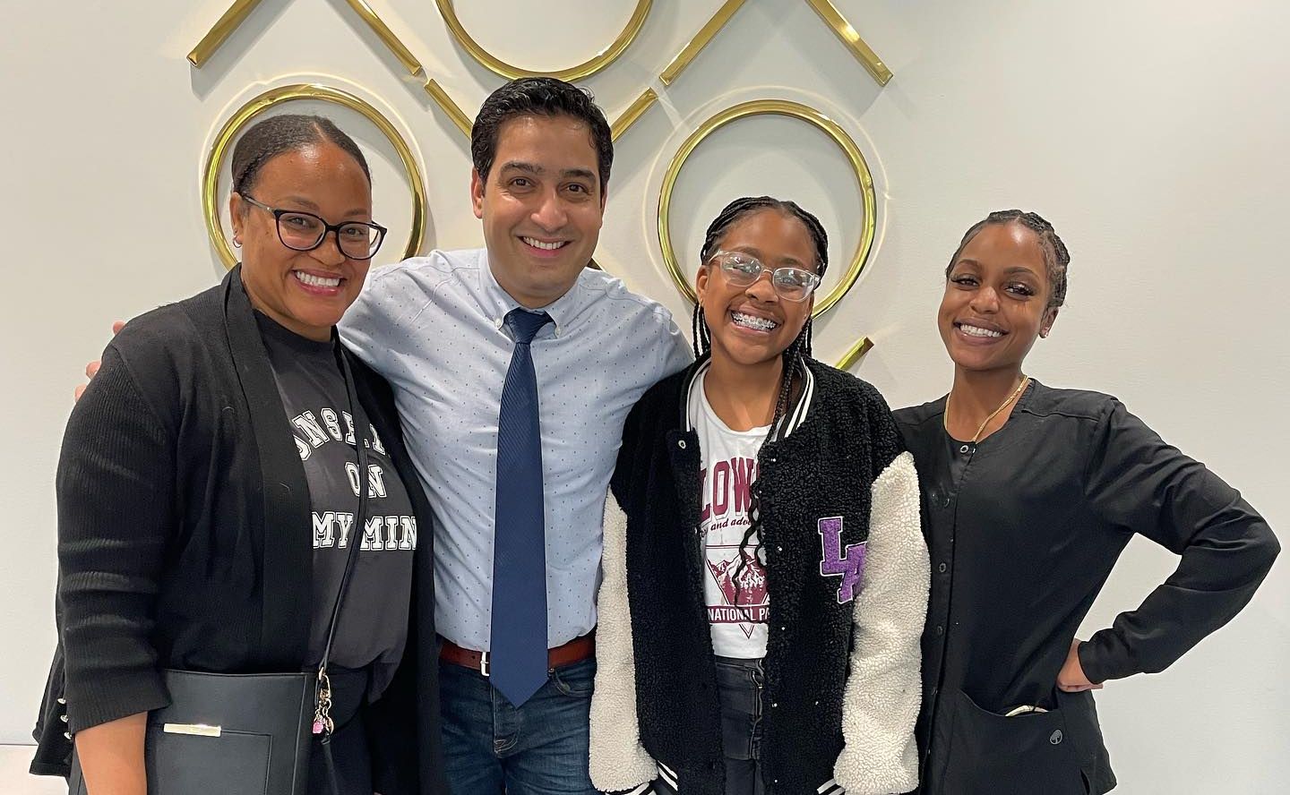 Happy teenagers smiling confidently at Behl Orthodontics