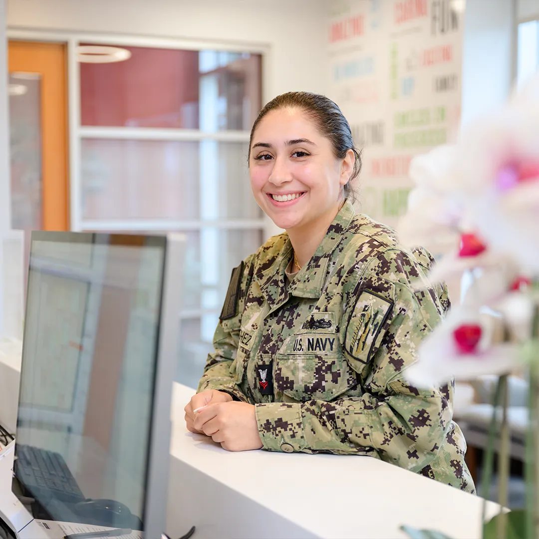 US Navy servicewoman at the Behl Orthodontics front desk